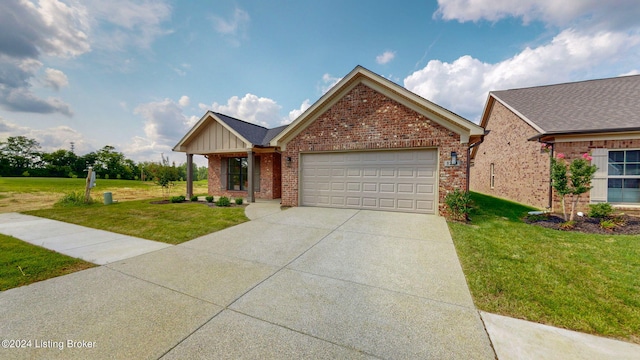 view of front of house with a front yard and a garage