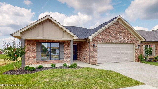 view of front of home featuring a garage and a front yard