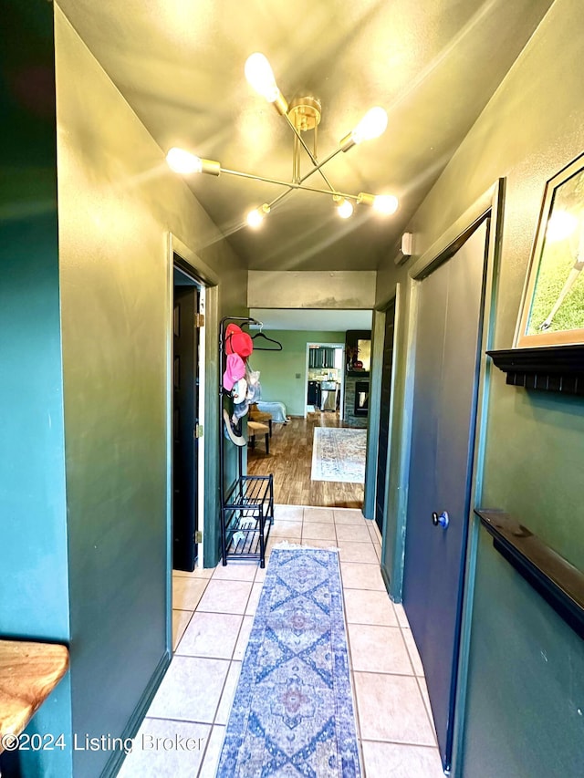 corridor with light tile patterned flooring