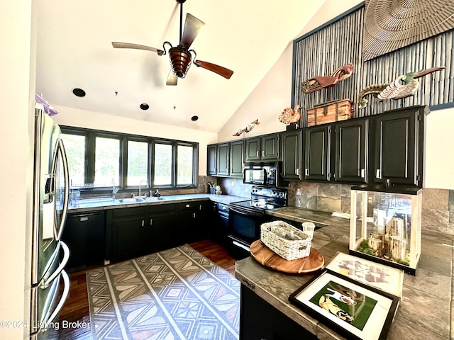 kitchen featuring sink, ceiling fan, high vaulted ceiling, tasteful backsplash, and black appliances