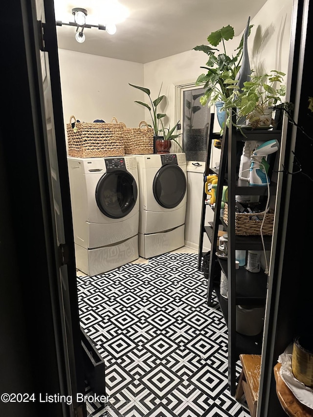 washroom with independent washer and dryer