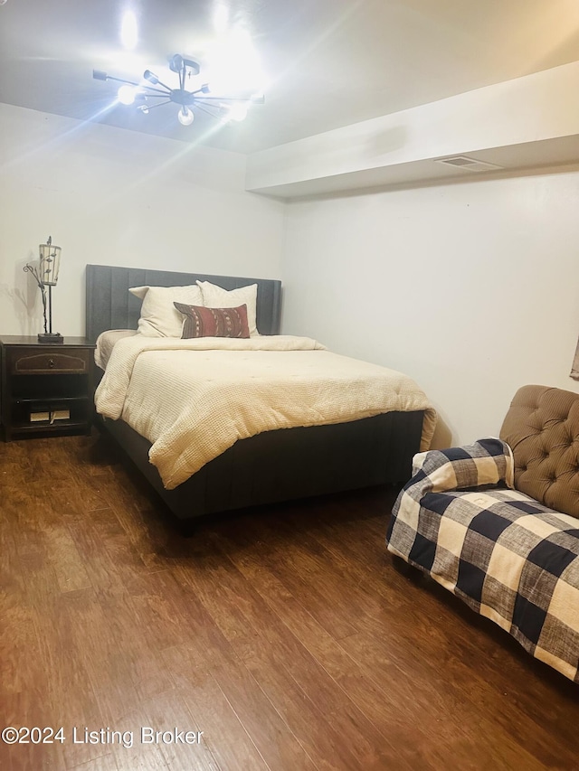 bedroom with dark wood-type flooring and ceiling fan