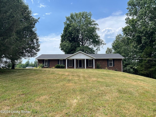 ranch-style home with a front lawn