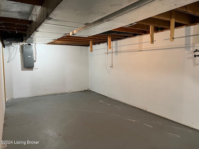 unfinished below grade area with electric panel