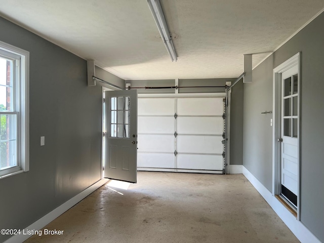 garage featuring baseboards