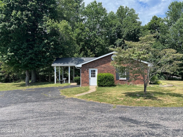 view of front of property with brick siding and a front yard