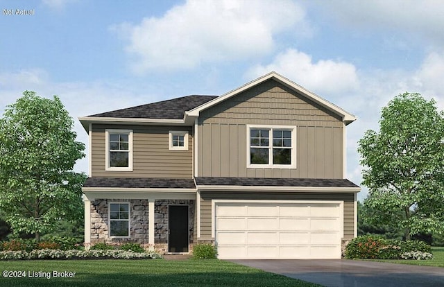 view of front of property with a garage and a front yard