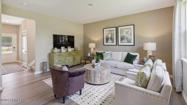 living room with light hardwood / wood-style flooring