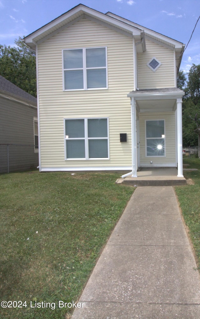 view of front of home with a front yard