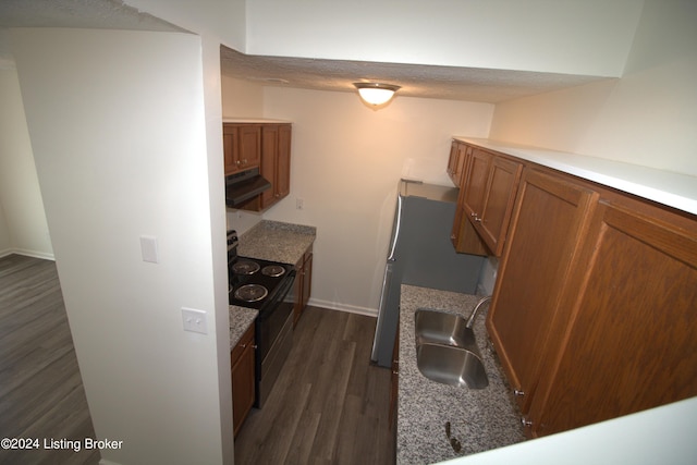 kitchen featuring dark hardwood / wood-style flooring, a textured ceiling, extractor fan, sink, and black electric range