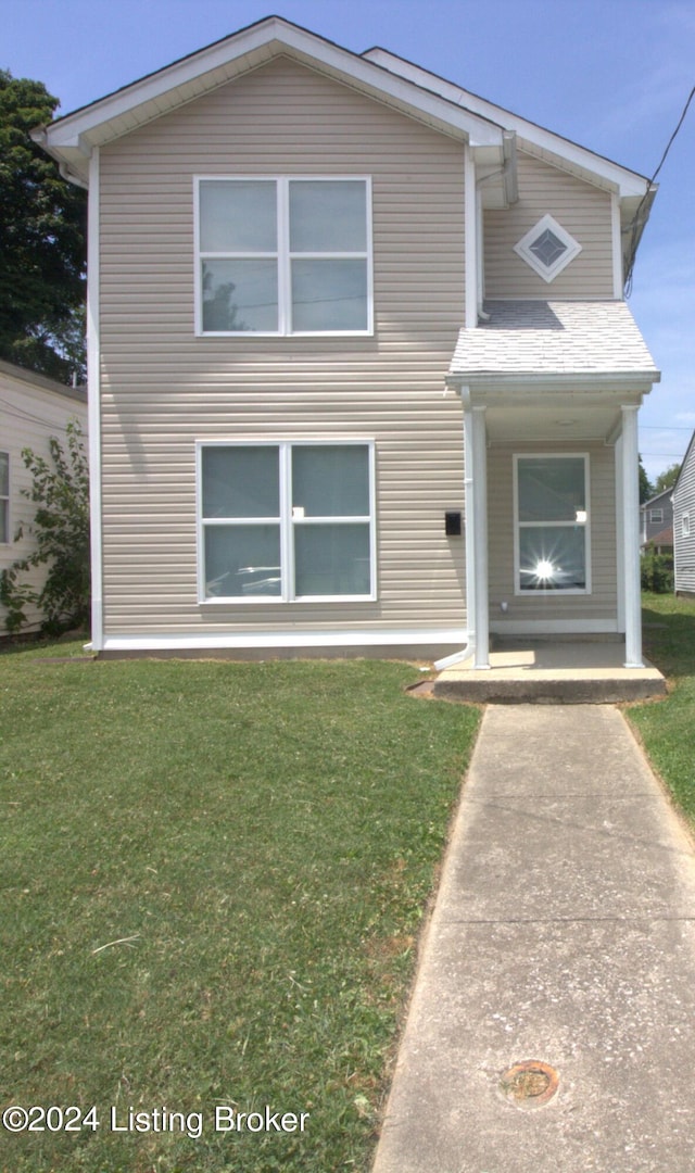 view of front of home with a front lawn