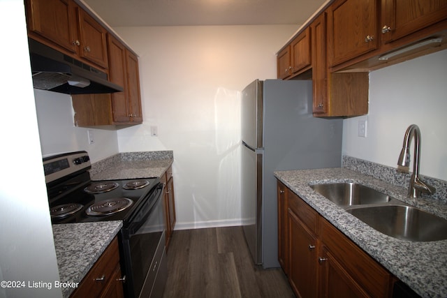 kitchen featuring electric range, light stone countertops, sink, and dark wood-type flooring