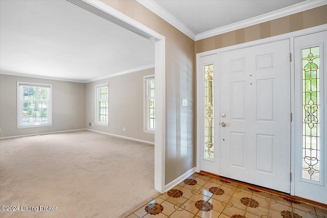 entryway featuring crown molding and light carpet