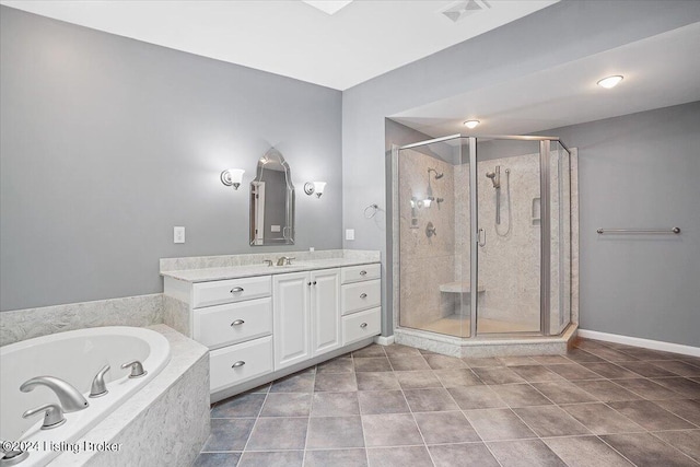 bathroom featuring tile patterned floors, vanity, and separate shower and tub