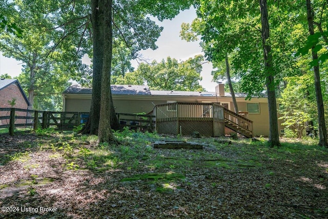 rear view of house featuring a deck