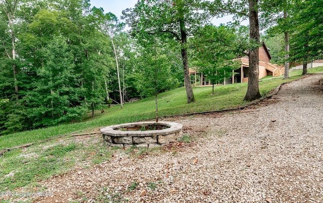 view of yard with a fire pit