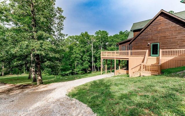 view of yard featuring a wooden deck