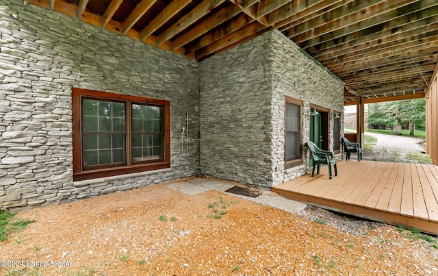 property entrance with a wooden deck