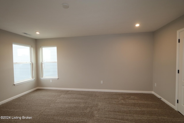 spare room featuring carpet floors