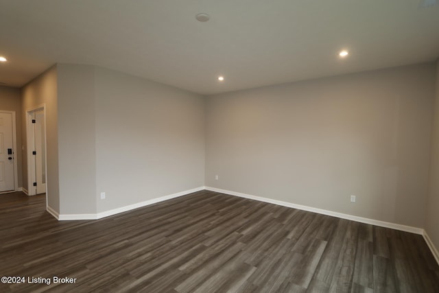 empty room featuring dark hardwood / wood-style flooring