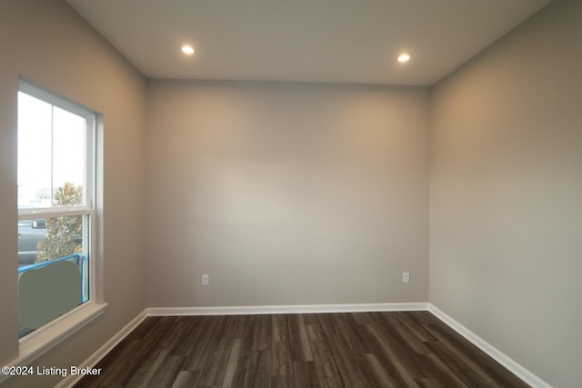 unfurnished room featuring dark hardwood / wood-style floors