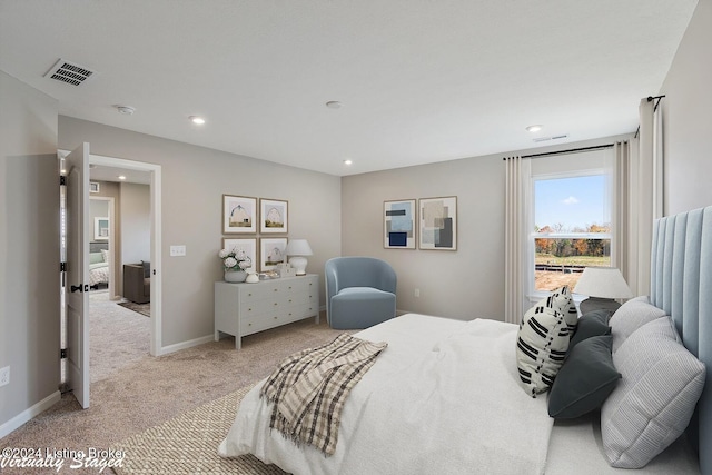 bedroom with light colored carpet