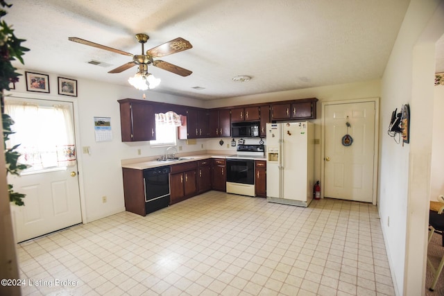 kitchen with ceiling fan, sink, black appliances, and a textured ceiling