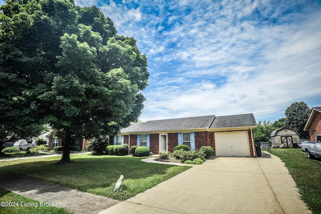 ranch-style house with a front yard, a garage, and a storage shed