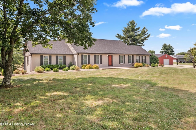 view of front facade featuring a garage and a front lawn