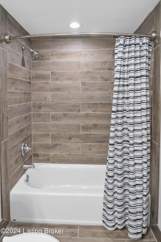 bathroom featuring shower / bathtub combination with curtain