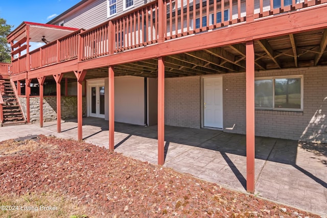 back of property featuring a patio and a deck