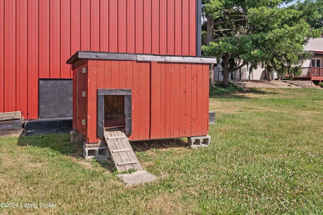 view of outdoor structure with a lawn