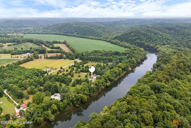 birds eye view of property with a water view and a rural view