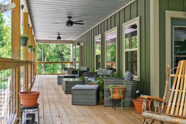 deck featuring ceiling fan and an outdoor living space