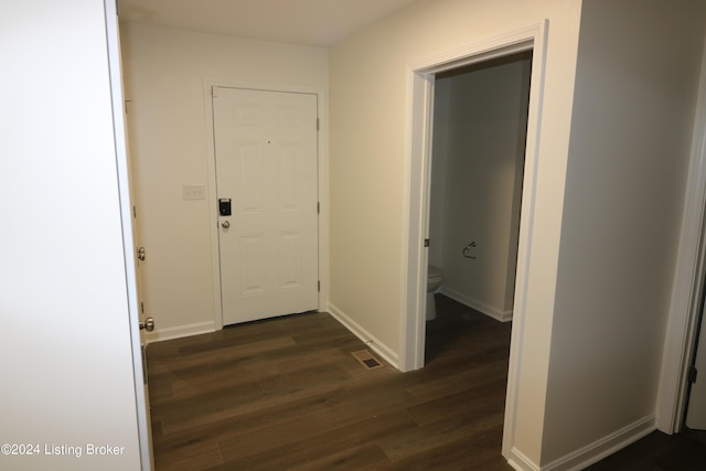 corridor featuring dark hardwood / wood-style flooring