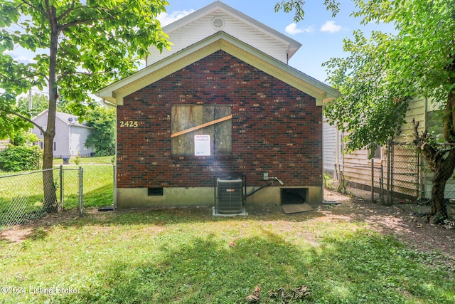 2425 Elliott Ave, Louisville, KY 40211 - rear view of house with central AC unit and brick siding