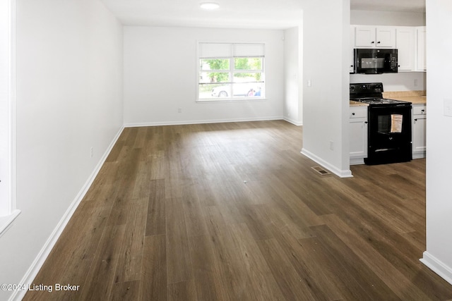 2425 Elliott Ave, Louisville, KY 40211 - kitchen featuring black appliances, dark wood-style flooring, light countertops, white cabinets, and baseboards