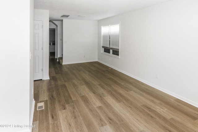 empty room with wood-type flooring