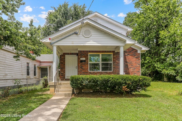 2425 Elliott Ave, Louisville, KY 40211 - view of front of house featuring brick siding and a porch