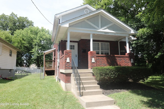 bungalow-style house featuring a front yard and a porch