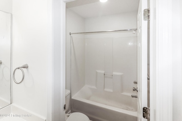 bathroom with shower / bathtub combination and toilet