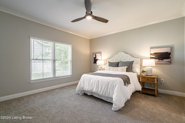 bedroom with carpet floors, ornamental molding, baseboards, and a ceiling fan