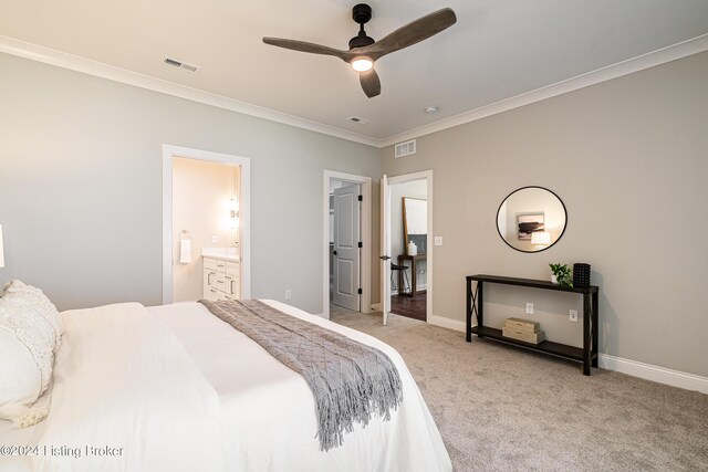 carpeted bedroom with ornamental molding, visible vents, and baseboards