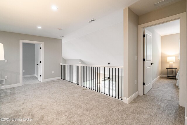 interior space featuring carpet, visible vents, baseboards, and recessed lighting