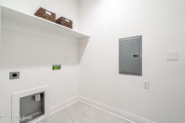 laundry room featuring hookup for a washing machine, hookup for an electric dryer, laundry area, electric panel, and baseboards