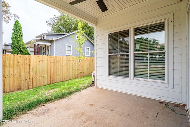 view of patio / terrace featuring ceiling fan and fence