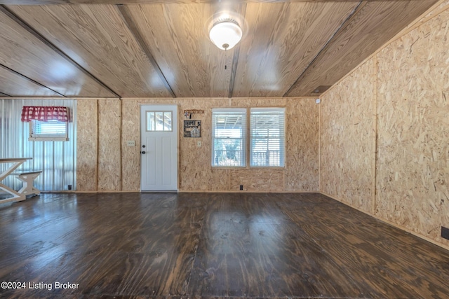 interior space featuring wood-type flooring, wood ceiling, and wood walls