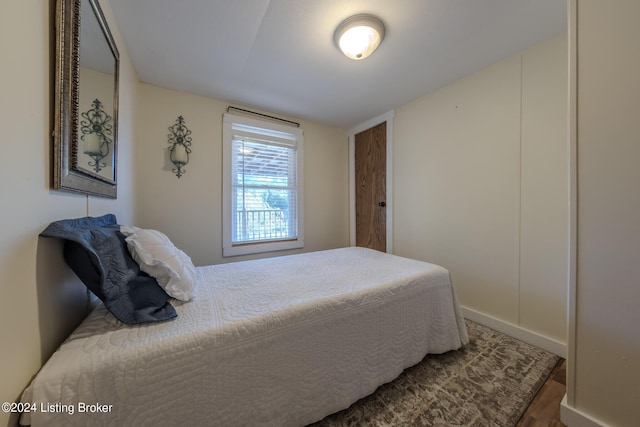 bedroom with wood-type flooring