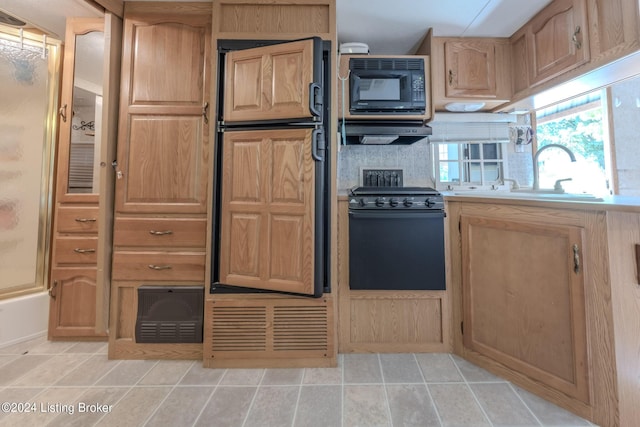 kitchen featuring sink and black appliances