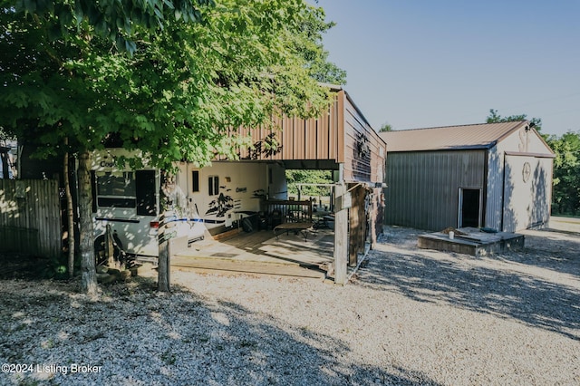 back of property with an outbuilding